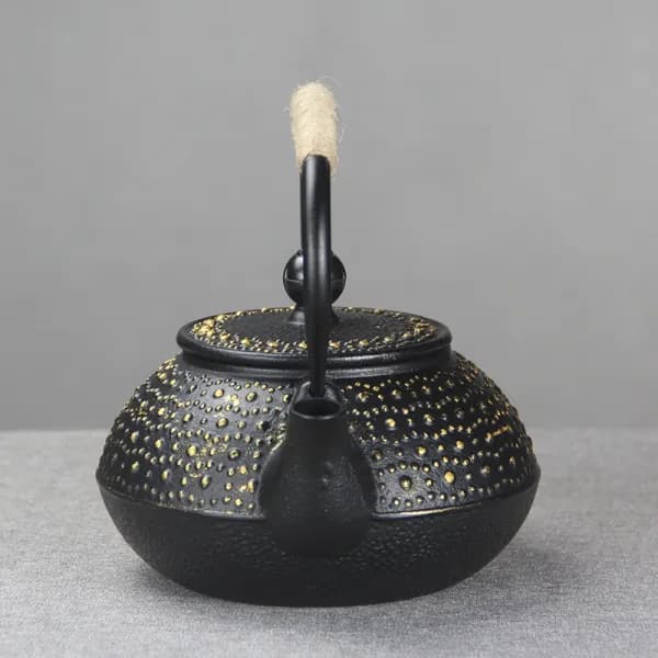 Black hammered teapot with gold dots